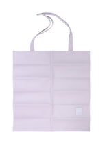 The PATA PA by IM MEN is a flat, light purple foldable tote bag in polyester suede, featuring two handles, horizontal creases, and a small white square patch at the bottom right. - LIGHT PURPLE （no.80）