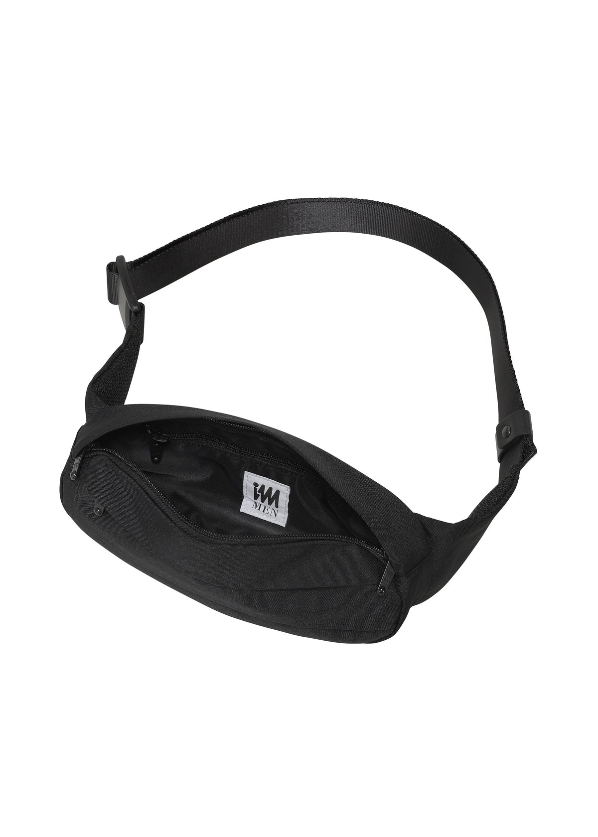 Introducing the CUMMERBUND BAG by IM MEN: This sleek black waist bag features an open zipper showcasing its spacious inner compartment and a white tag with black text. The adjustable strap ensures a comfortable fit, while its compact design is ideal for carrying your essentials. Subtle stitching inspired by a cummerbund motif adds an elegant touch to this sophisticated and practical accessory. view 4 of 11