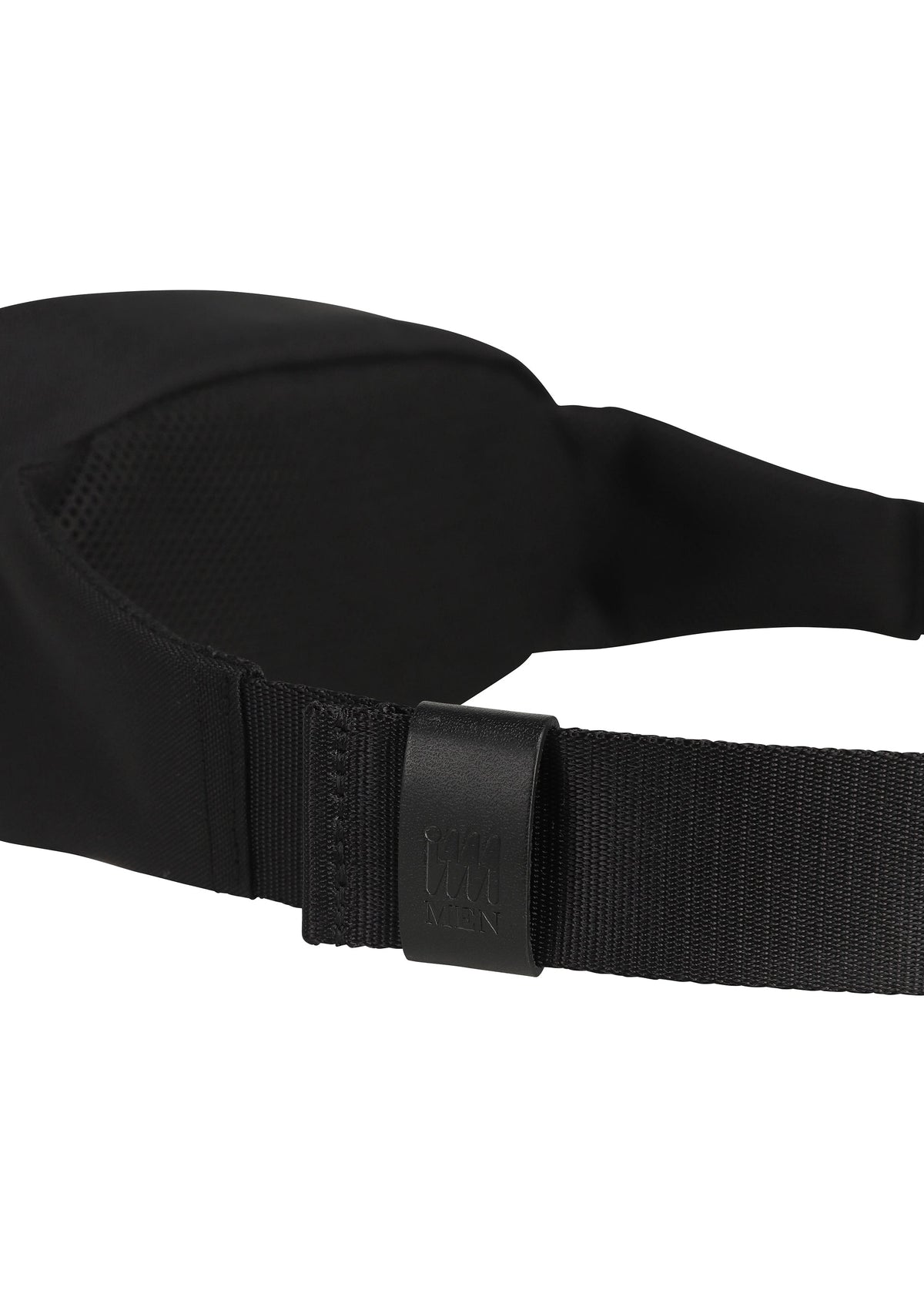 Close-up of a black adjustable strap with a plastic buckle, subtly embossed with the IM MEN logo, attached to the CUMMERBUND BAG—a compact black fabric accessory by IM MEN featuring hints of a cummerbund motif in its design. view 7 of 11