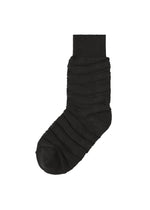 The IM MEN FORMAL WAVE SOCKS feature a single black elastic sock with ribbed horizontal texture and a solid cuff, shown on a white background for a stylish and comfortable formal option. - BLACK （no.15）