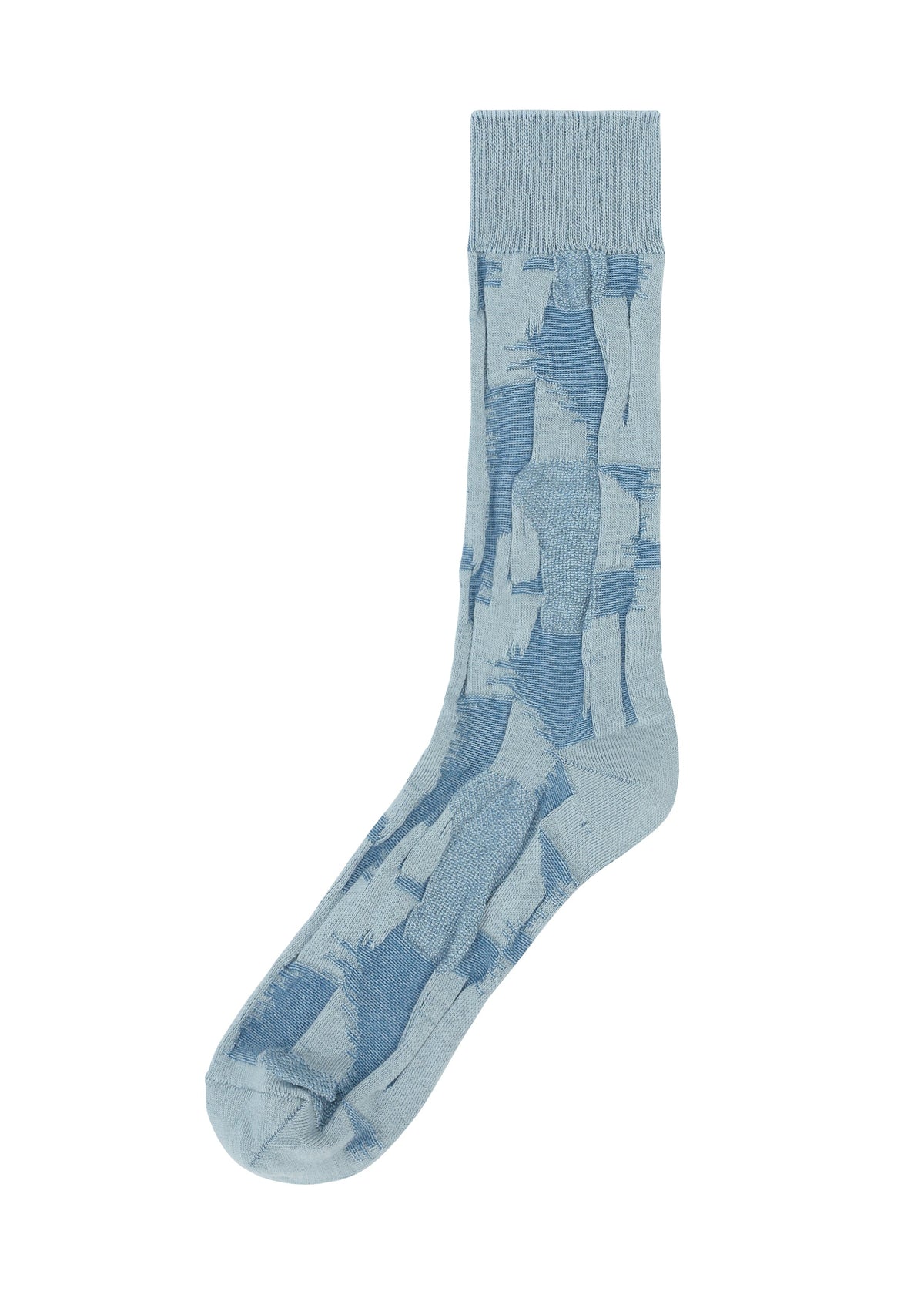 IM MEN’s KASURI SOCKS are laid flat on a white background, showcasing their light blue yarn-dyed fabric adorned with abstract, irregular darker blue rectangle patterns. view 3 of 4