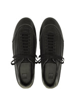 A pair of IM MEN FLIPPER black lace-up sneakers crafted from supple leather, photographed from above on a white background.