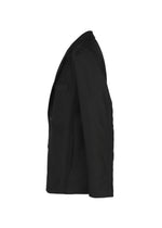 The CLAY textile jacket by IM MEN is displayed in black from a side angle, with its sleeves and lapel visible, emphasizing the sculptural form against a plain white background.