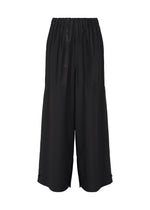 The IM MEN WAFT BLACK pants feature a wide-leg culotte style, linen-like texture, elastic waistband, and a loose, flowy fit, shown on a plain white background.