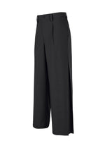 WINGS BLACK by IM MEN are wide-leg black trousers with pleats, side pockets, belt loops, and a button closure, featuring a loose silhouette on a plain white background.