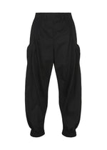 The CLAY voluminous black pants by IM MEN feature a high waist, pleated front, side pockets, and elasticized ankles, shown against a plain white background. - BLACK （no.15）