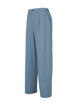 The COMFORT COTTON pleated wide-leg straight pants by IM MEN are crafted from high-twist organic cotton in light blue, offering a smooth feel and featuring button and zipper closure, belt loops, and side pockets—all showcased against a white background.