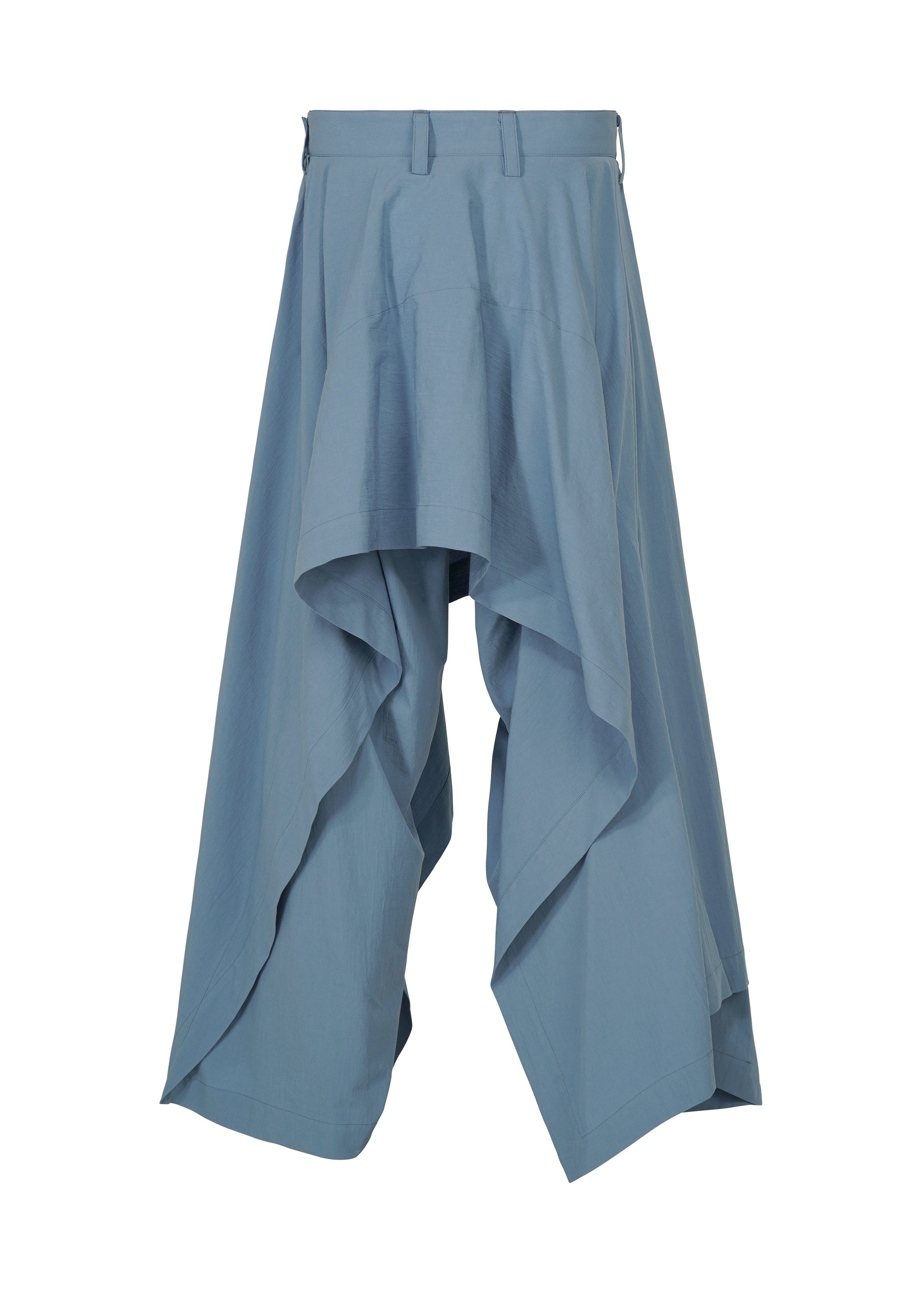 Zoomed view COMFORT COTTON by IM MEN features blue wide-leg pants in a high-twist organic cotton, showcasing a draped, layered silhouette with a high waist. Their distinctive asymmetric design creates irregular-cut hems for a skirt-meets-pants look.