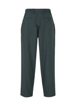 The IM MEN FLUENT pants in dark green feature a high waist, diagonal cut, belt loops, side and buttoned back pockets, and are made from breathable, wrinkle-resistant polyester. Shown against a white background.