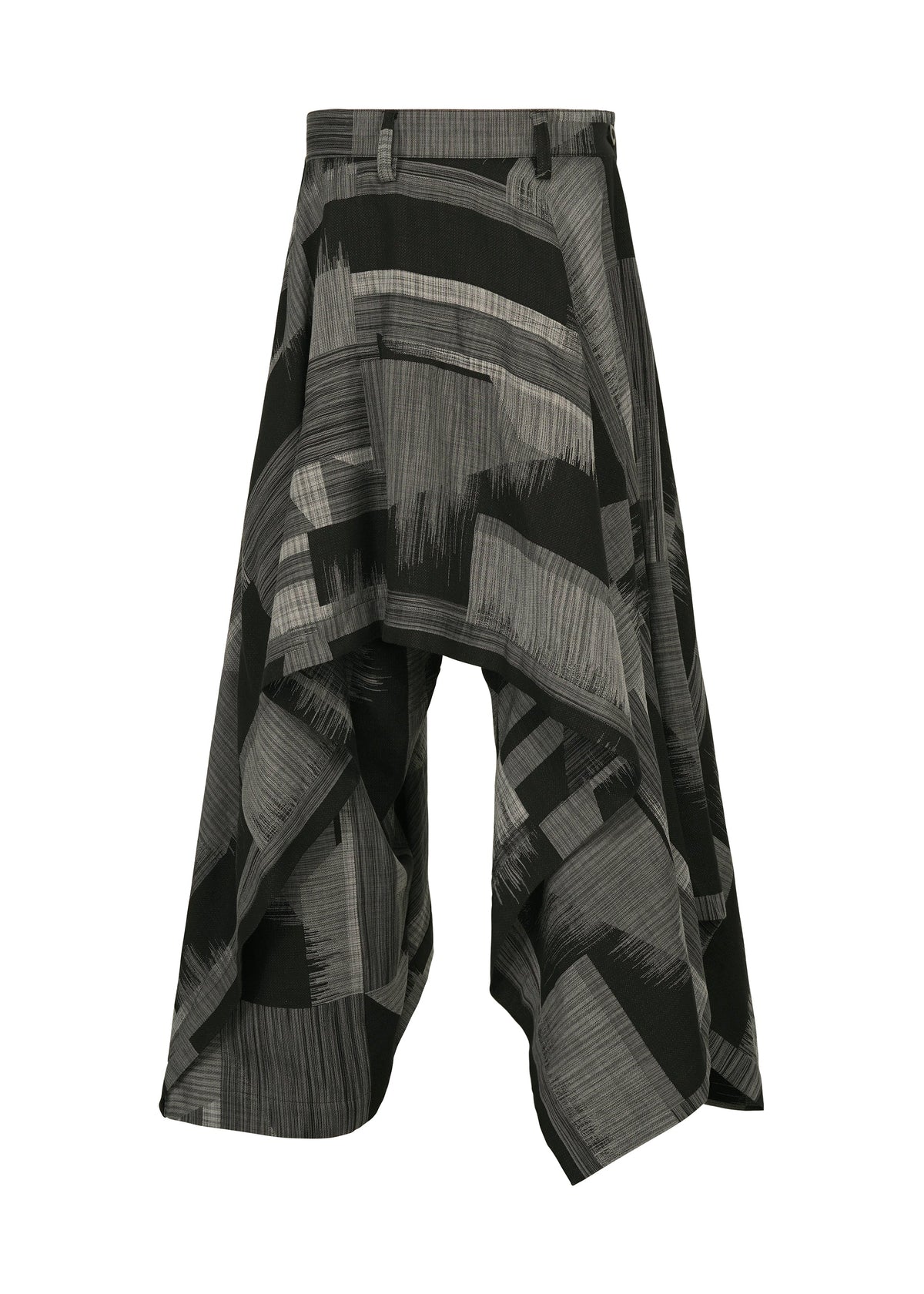 IM MEN’s KASURI pants are black and gray wide-leg culottes inspired by Kasuri weaving, featuring an abstract pattern, asymmetrical draped design, and belt loops. Shown on a white background. view 1 of 8