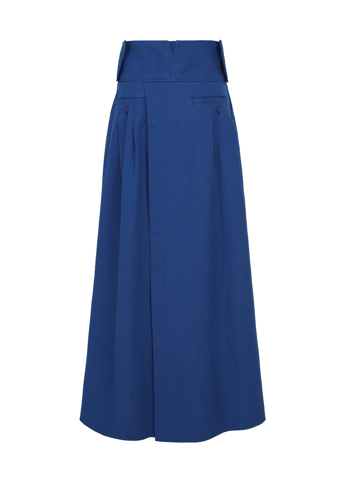 The IM MEN SHRINK WOOL is a long, high-waisted royal blue skirt in hard-twist wool, featuring a wide waistband, front pleats, two hip buttons, and a structured, slightly flared silhouette for elegant style. view 3 of 8