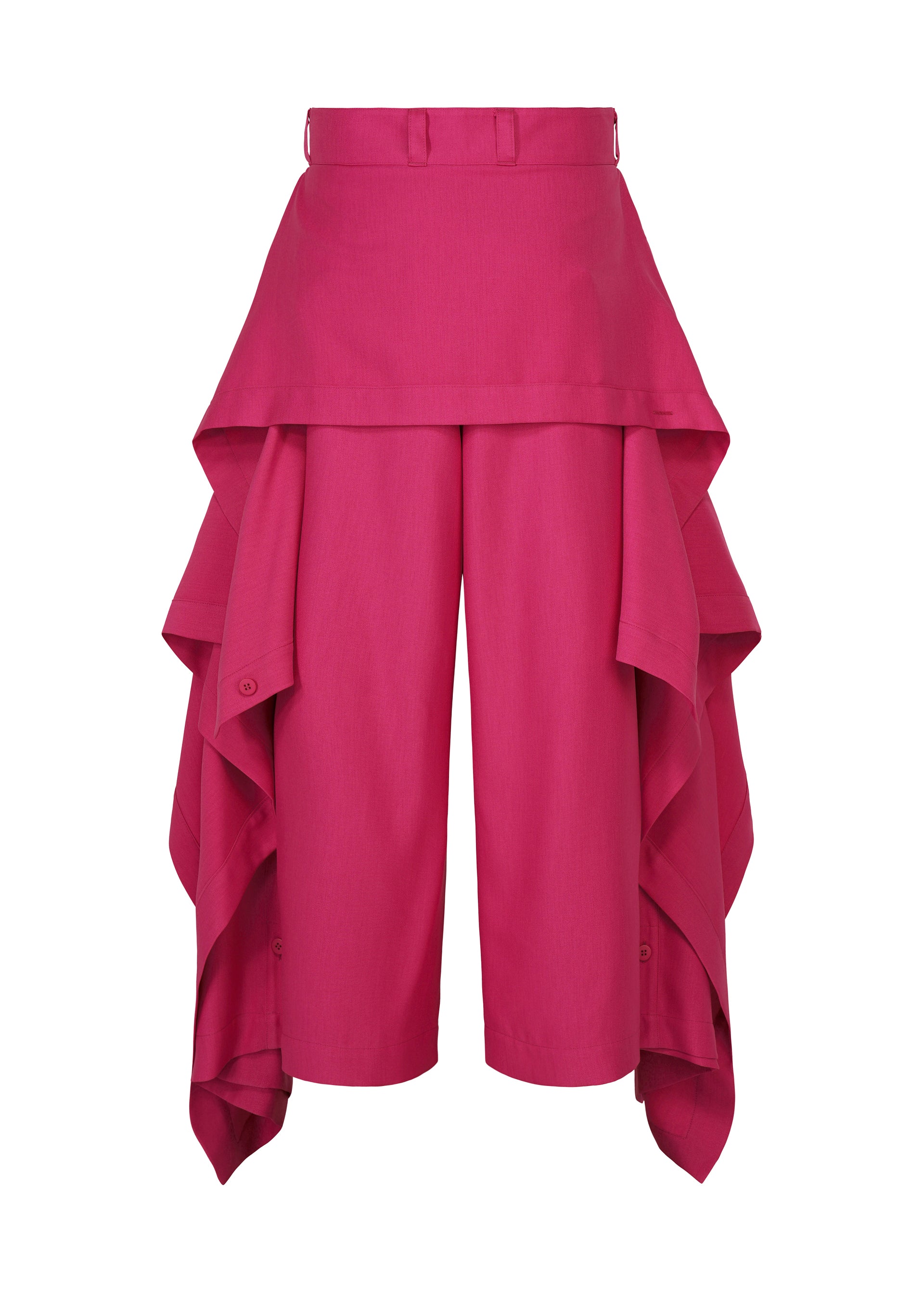Zoomed view IM MEN’s BREEZE DRAPE pants feature a vibrant pink hue and a high-waisted fit, with layered cascading fabric panels along each side that create a skirt-like effect over the shorts—offering a chic, modern take on classic flowy pants.