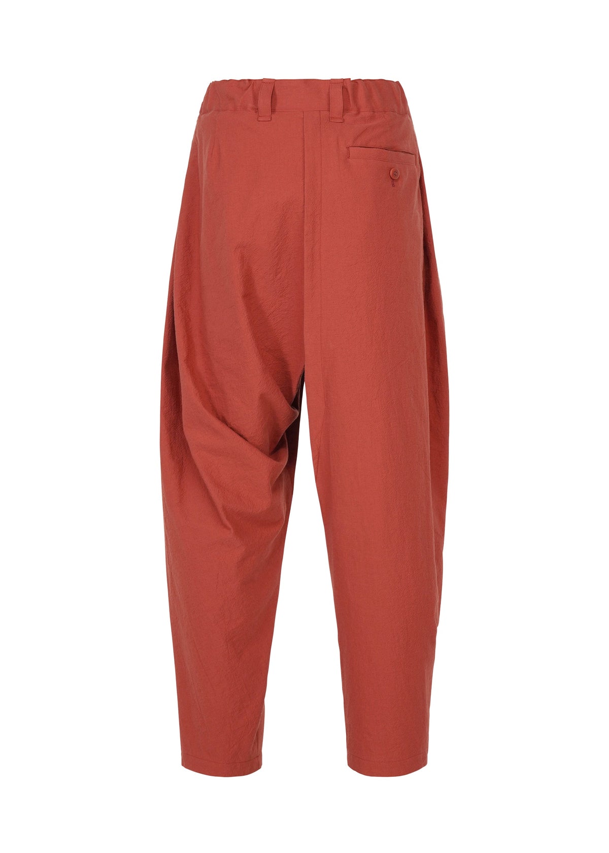 Loose-fitting, high-waisted COTTON YAK pants in a rust hue with a relaxed silhouette, single back pocket, and cropped legs from IM MEN’s Autumn Winter 2026/27 Collection, shown against a plain white background. view 4 of 9