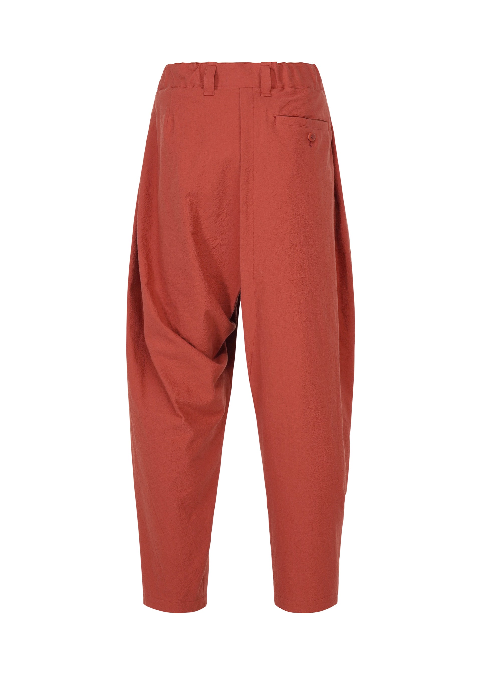 Zoomed view Loose-fitting, high-waisted COTTON YAK pants in a rust hue with a relaxed silhouette, single back pocket, and cropped legs from IM MEN’s Autumn Winter 2026/27 Collection, shown against a plain white background.