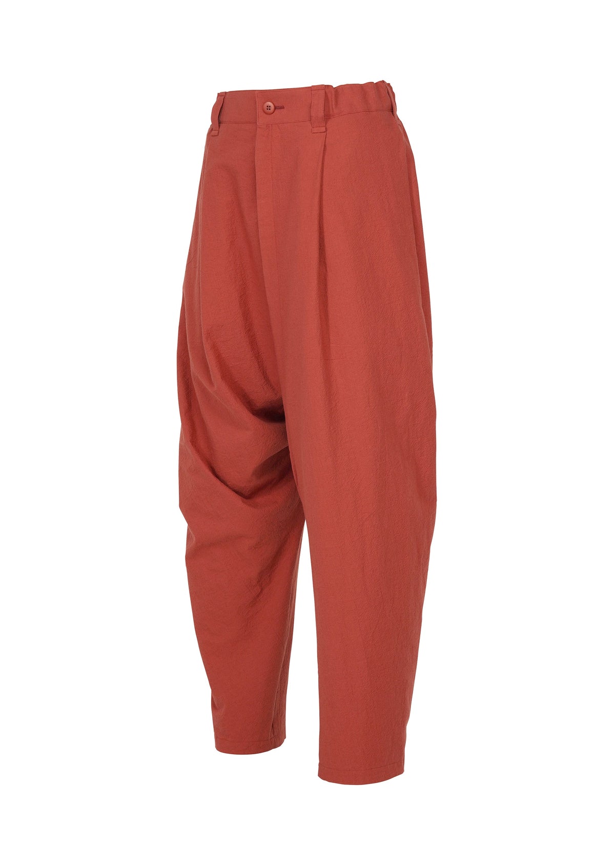 Loose-fitting, high-waisted COTTON YAK pants in vibrant red cotton from IM MEN, designed with pleats at the waist and a relaxed silhouette. These trousers feature tapered legs and are presented on a plain white background as part of the IM MEN Autumn Winter 2026/27 Collection. view 5 of 9