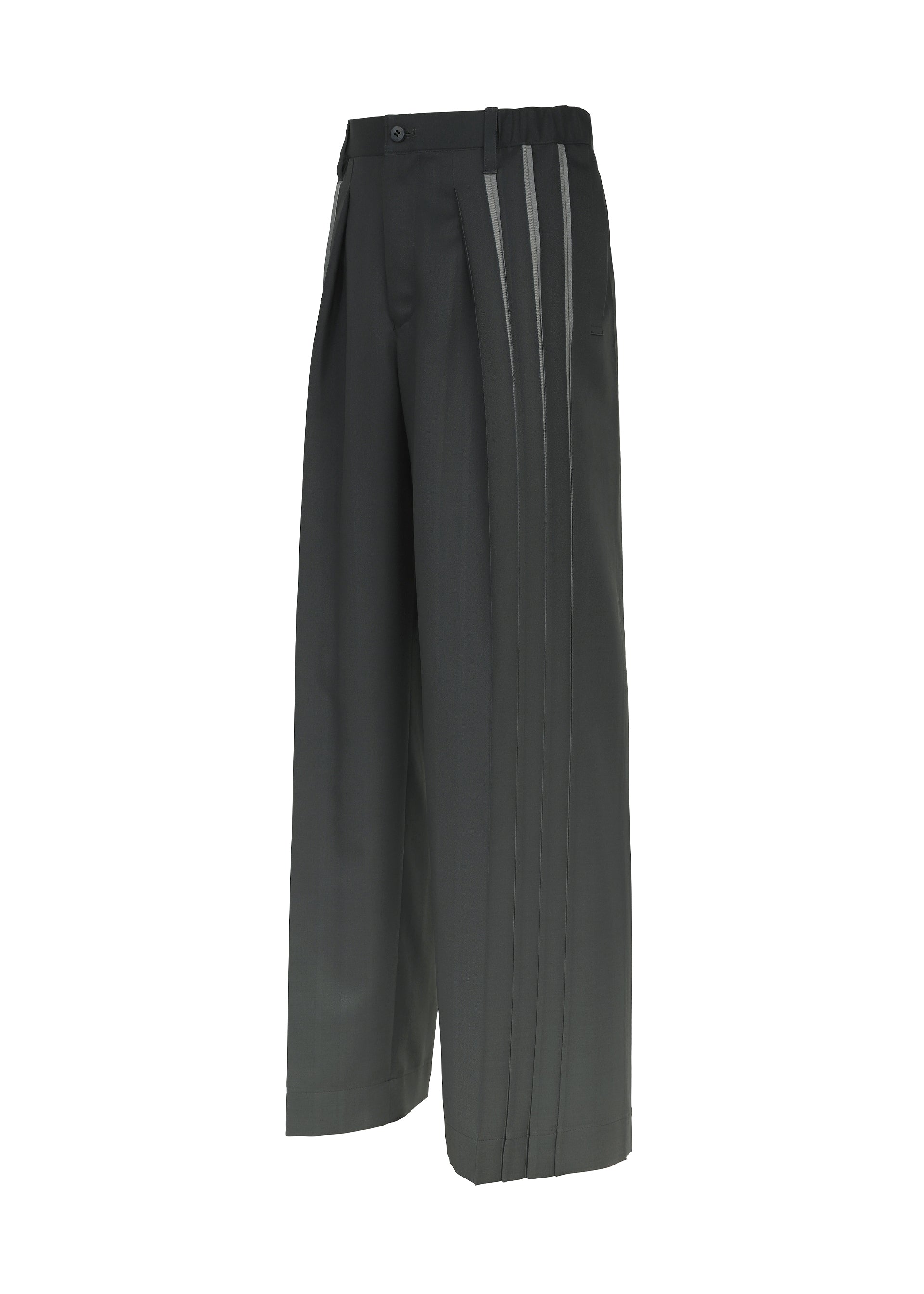 Zoomed view The IM MEN “DAWN RAY” trousers feature a wide-leg silhouette, transfer-printed black fabric with gray vertical stripe accents along the sides, a pleated front, and an elastic waistband, shown against a white background.