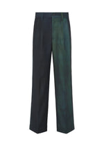 The GRADATION WOOL by IM MEN are dark, wide-leg worsted wool pants with a subtle green gradient on one side, front button closure, and belt loops—made with a unique dye technique. - BLUE （no.72）