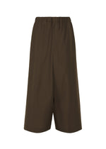 The SUAVE shorts by IM MEN feature a relaxed, loose fit, knee-length cut, and elastic waistband. Crafted from a wool blend in brown, they are styled for comfort and displayed against a white background. - BROWN （no.44）