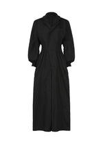The CLAY dress by IM MEN is a long black rib knit dress featuring a fitted waist, long puffed sleeves, and a notched collar. With a concealed front closure and calf-length hem, it offers both warmth and elegance, making it ideal for IM MEN Autumn Winter 2026/27. - BLACK （no.15）