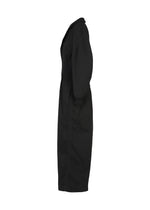 A long-sleeved, ankle-length black sculptural jumpsuit—CLAY by IM MEN—is shown from the side against a white background. Crafted in rib knit fabric, this garment features a collared neckline and a fitted waist, embodying the modern sophistication of the IM MEN Autumn Winter 2026/27 collection.