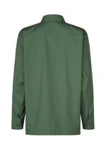 The IM MEN 140/2 SHIRT is a green, long-sleeved shirt shown from the back, featuring a regular collar, buttoned cuffs, and a straight hem. Made from fine 140s cotton, it has a simple, classic design with no visible patterns or logos.