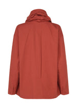 A rust-colored, long-sleeve jacket with a high collar from IM MEN, viewed from the back. Made from lightweight and durable COTTON YAK fabric, this piece offers comfort and ease. Inspired by the IM MEN Autumn Winter 2026/27 collection, it features a relaxed, loose fit with buttoned cuffs for a modern yet timeless silhouette.