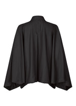 A back view of IM MEN's SWING BLACK—a loose, black, wrinkle-resistant long-sleeve outerwear with wide draped sleeves and a collar, resembling a lightweight kimono-style jacket.