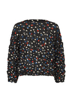 The TIME DOTS VELOUR MERINGUE by me ISSEY MIYAKE is a black long-sleeved top with crinkled fabric, featuring an abstract red, blue, and white dotted pattern on its textured surface. - BLACK-HUED （no.19）