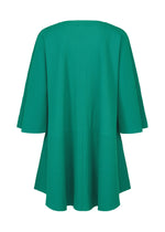 The SWING PLEATS dress by me ISSEY MIYAKE is a green, loose-fitting piece with fine knit pleats and wide sleeves, shown from the back against a plain white background.