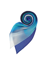 The AURORA PLEATS STOLE by me ISSEY MIYAKE, shown in a spiral on a white background, features pleats and a gradient of blue shades from dark navy to light blue and white.
