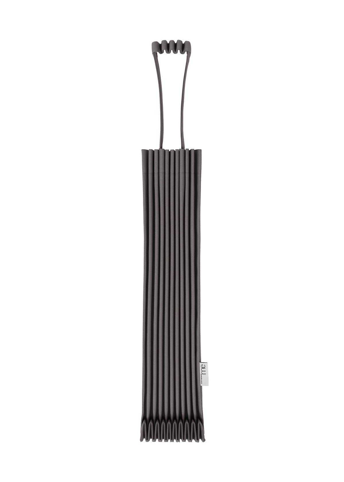 The TRUNK PLEATS BAG 12 by me ISSEY MIYAKE, shown against a white background, features black ribbed silicone, a distinctive top handle, and a small fabric tag on the side. view 1 of 8