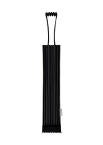 A black, ribbed, rectangular TRUNK PLEATS BAG 12 by me ISSEY MIYAKE, featuring two distinctive loop handles at the top and a small white side tag, photographed against a white background. - BLACK （no.15）