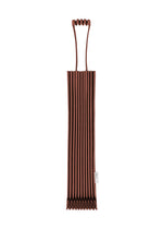 The me ISSEY MIYAKE TRUNK PLEATS BAG 12 is a brown, pleated tote with a unique handle and foldable design, shown flat on a white background. A small white label is attached to one side near the bottom. - BORDEAUX （no.84）