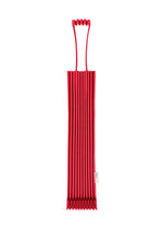 A red, accordion-style silicone trivet—featuring a distinctive top handle inspired by the iconic TRUNK PLEATS BAG 12 from me ISSEY MIYAKE—is shown standing vertically against a white background. Its bold hue and pleated design evoke the bag’s signature look, making it both practical and visually striking. - CHERRY RED （no.92）
