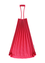A bright pink TRUNK PLEATS BAG 12 by me ISSEY MIYAKE stands upright in its vivid, pleated origami-style design with a unique handle against a white background.