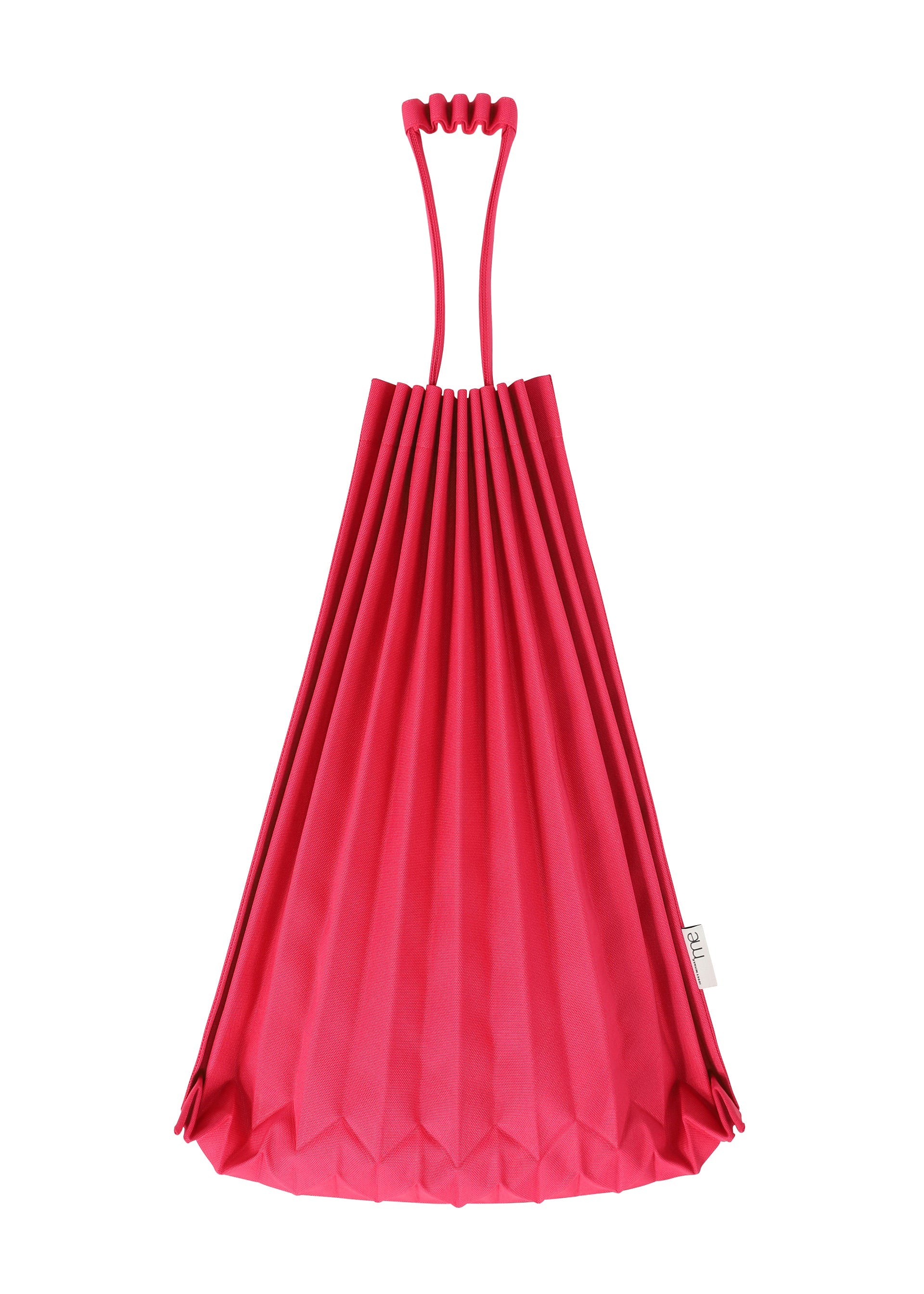 Zoomed view A bright pink TRUNK PLEATS BAG 12 by me ISSEY MIYAKE stands upright in its vivid, pleated origami-style design with a unique handle against a white background.