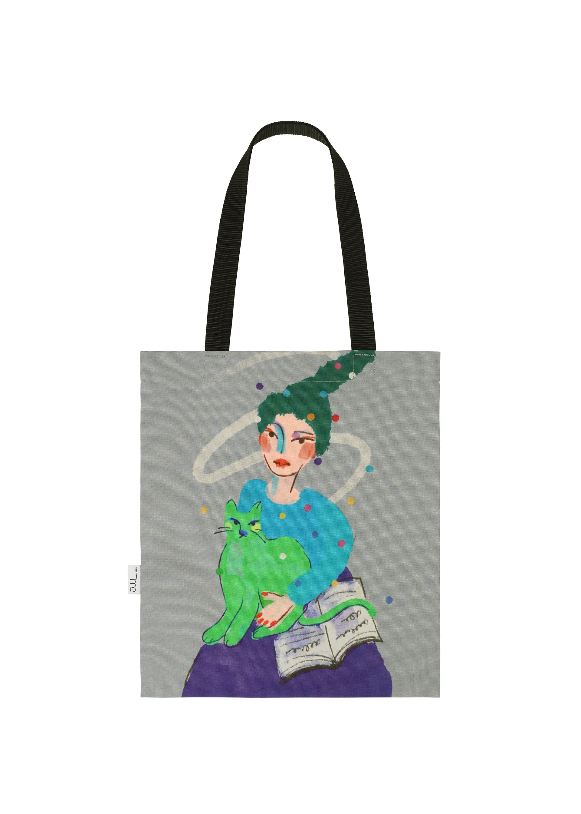 Zoomed view The me ISSEY MIYAKE CAT BAG features black handles and a vibrant design of a green-haired person holding a green cat beside an open book, with swirling shapes and dots on a gray background for a whimsical touch.