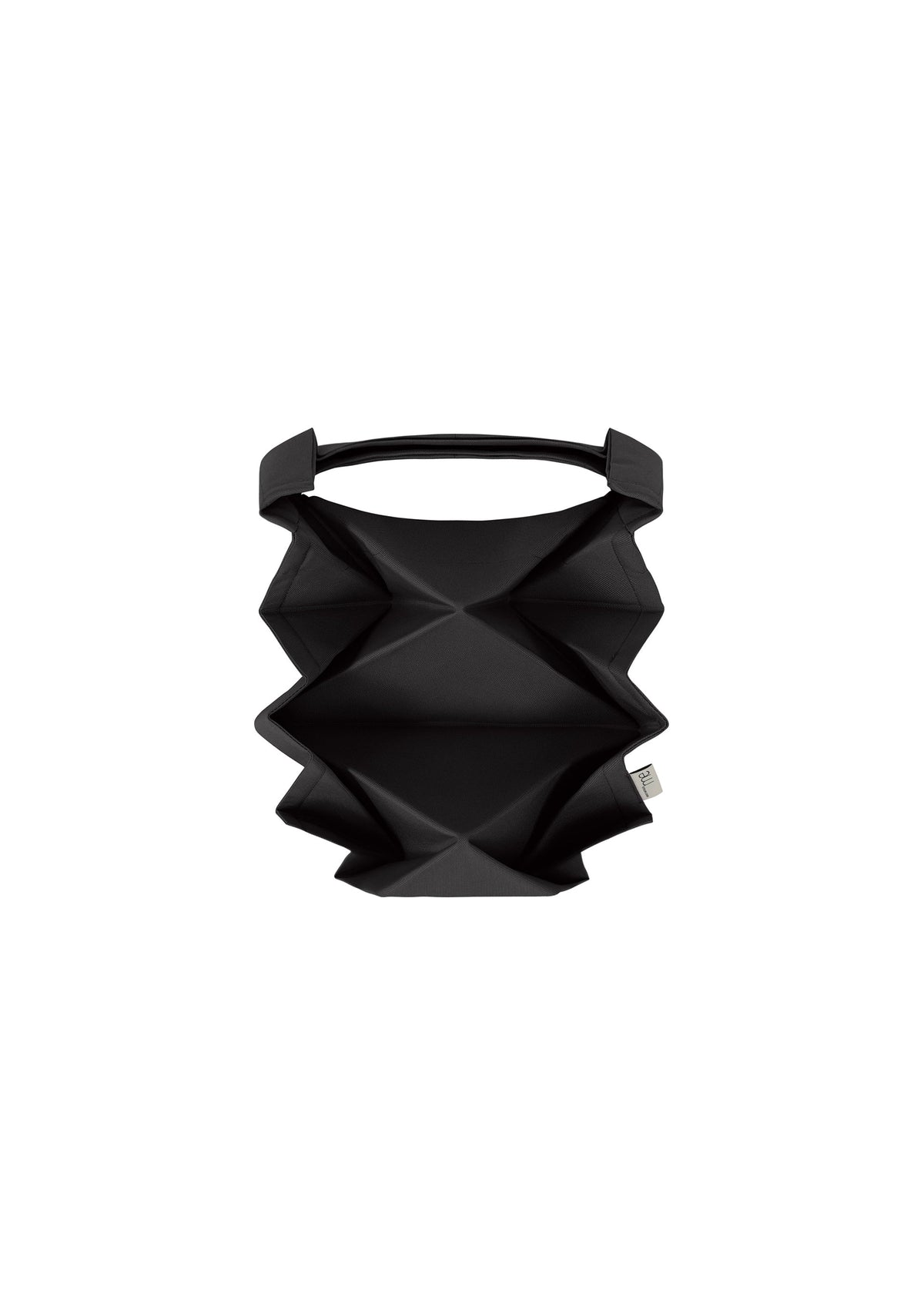 The GEOMETRIC PLEATS BAG by me ISSEY MIYAKE features a black geometric pattern, origami-inspired sharp angular folds, and a single top handle, shown against a plain white background. view 2 of 7
