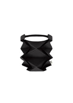 The GEOMETRIC PLEATS BAG by me ISSEY MIYAKE features a black geometric pattern, origami-inspired sharp angular folds, and a single top handle, shown against a plain white background. - BLACK （no.15）