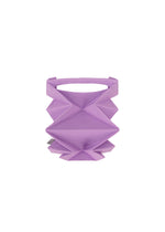 The GEOMETRIC PLEATS BAG by me ISSEY MIYAKE is a small, purple, handmade bag featuring geometric accordion-style pleats and an open top, displayed centered on a white background.
