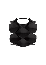 The GEOMETRIC PLEATS BAG by me ISSEY MIYAKE features handmade pleats, diamond-shaped protrusions, a top handle, and a sculptural origami-inspired design with a quadrilateral base in black. - BLACK （no.15）