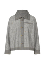The REmeTEX NEP DENIM by me ISSEY MIYAKE is a light gray, relaxed-fit button-up denim jacket with a wide collar, long sleeves, visible seams, cuffed wrists, and a left chest pocket. Made using an eco-friendly wool recycling technique.