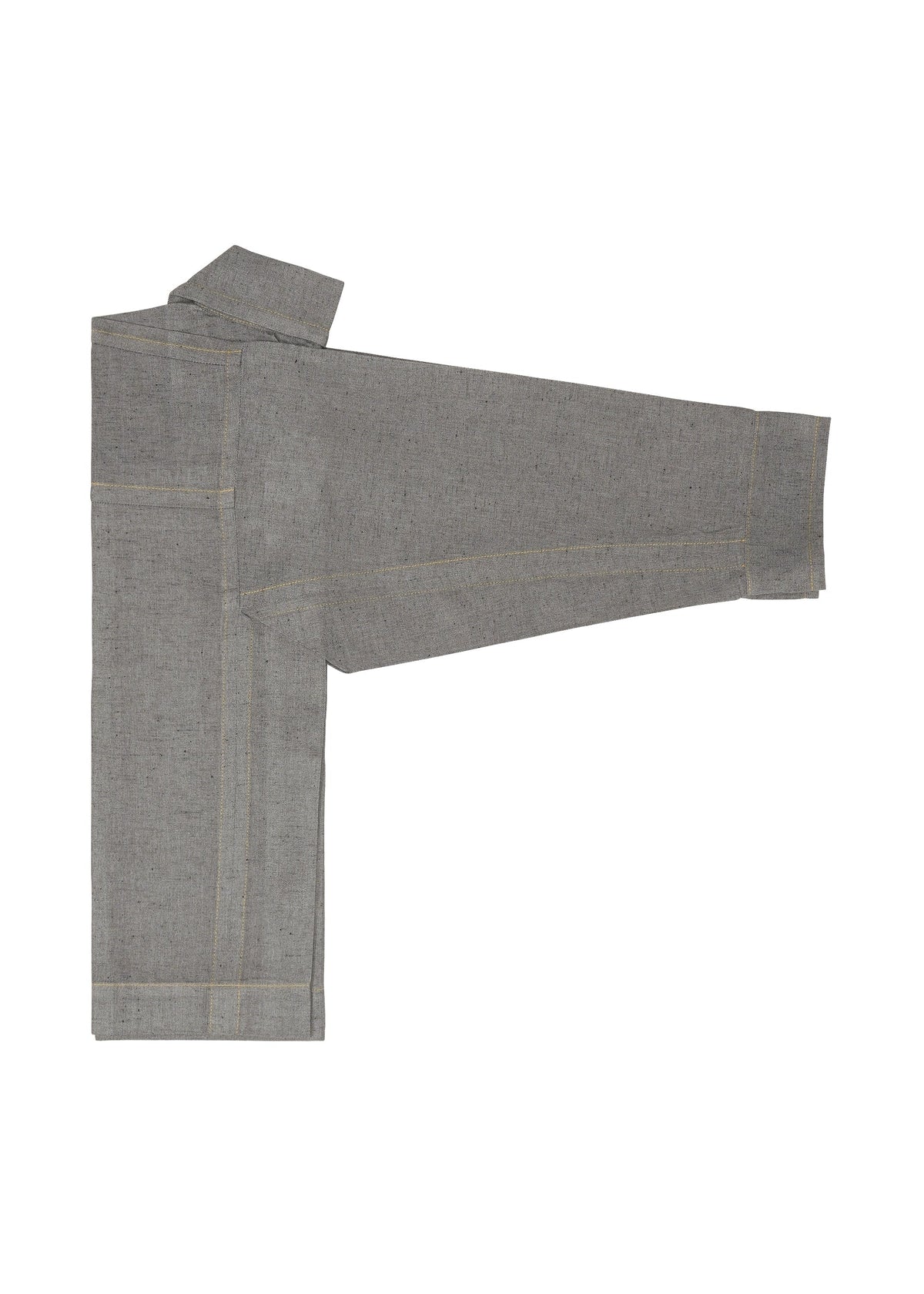 A folded long-sleeve REmeTEX NEP DENIM shirt by me ISSEY MIYAKE, in gray with visible seams, is laid flat on a white background, one sleeve extended outward to the right, resembling a reversible jacket. view 7 of 12