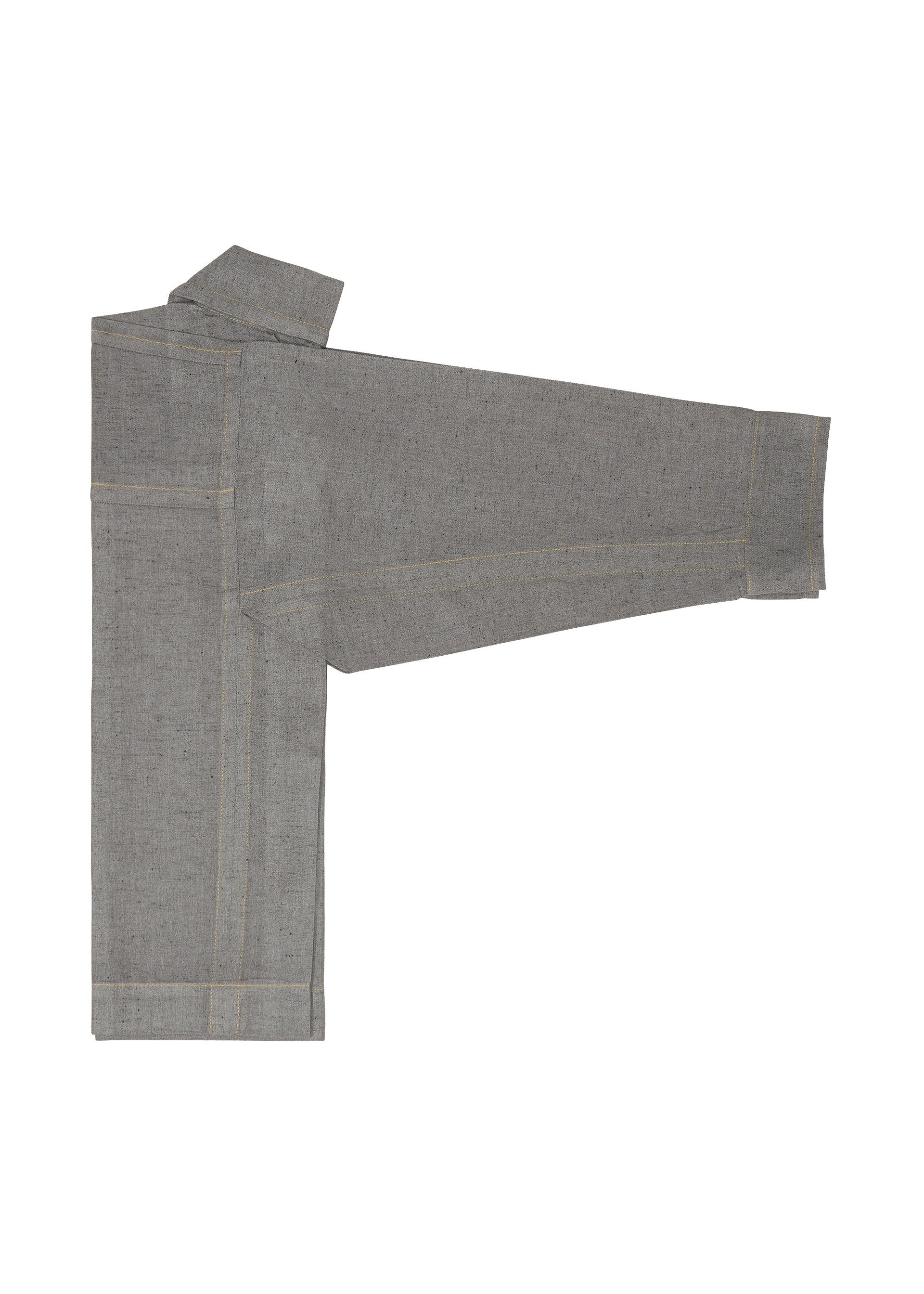 Zoomed view A folded long-sleeve REmeTEX NEP DENIM shirt by me ISSEY MIYAKE, in gray with visible seams, is laid flat on a white background, one sleeve extended outward to the right, resembling a reversible jacket.