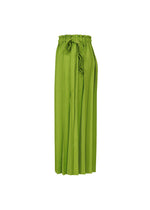 The CROSS PLEATS by me ISSEY MIYAKE are bright green high-waisted, wide-leg pants with unique pleats and a ruffled paperbag waistband, finished with a matching fabric tie belt.