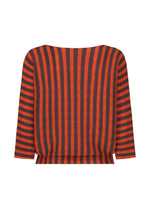 The MAGIC STRIPE top by me ISSEY MIYAKE features a back view with bold vertical orange and black stripes down the center, plus horizontal stripes on the sleeves and sides for a striking, stretchy look.