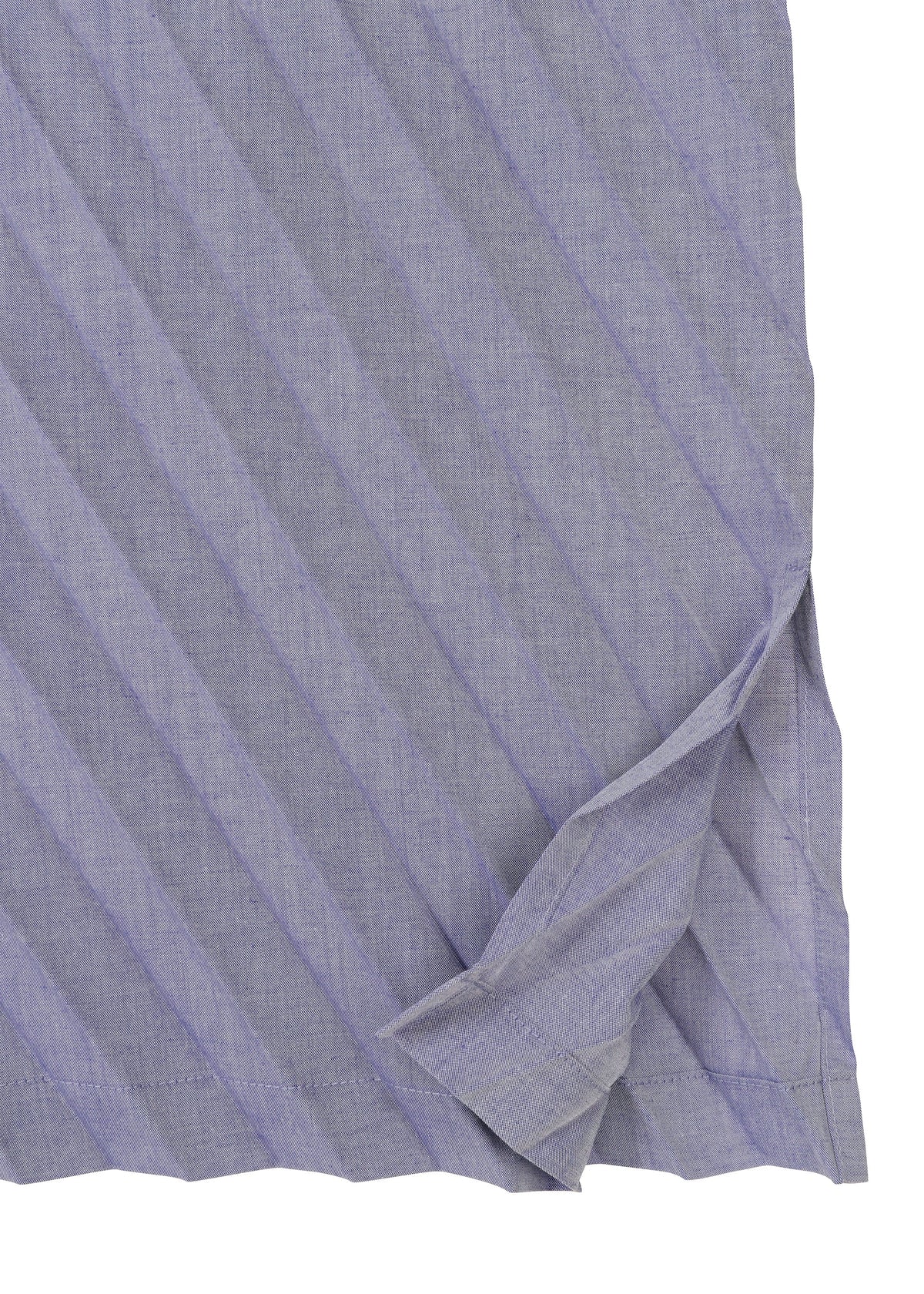 A close-up of the ANGLE PLEATS SHIRT by me ISSEY MIYAKE, featuring lightweight pleated purple fabric and a slit hem. view 5 of 9