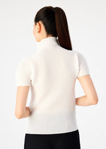 A woman with long dark hair in a ponytail is seen from the back, wearing me ISSEY MIYAKE's STRETCH PLEATS light short-sleeve high-neck top and black pants against a plain white background.