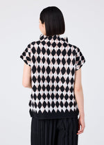 A person with short dark hair, seen from behind, wears the DIAMOND high-neck top by me ISSEY MIYAKE, featuring a black and light pink diamond pattern, paired with black pleated pants against a plain light background.