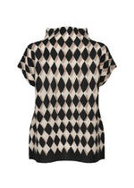 The DIAMOND top by me ISSEY MIYAKE is a short-sleeve, stretch-pleated design with a high collar and black and beige diamond motif. Shown flat with the back facing the viewer.